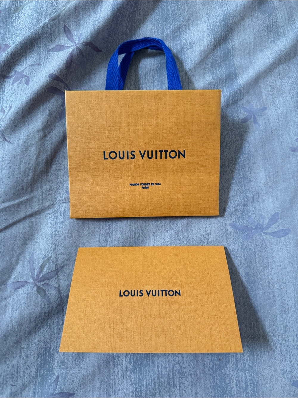 Small Louis Vuitton Orange Gift Bag with Royal Blue Handle and Folio.
